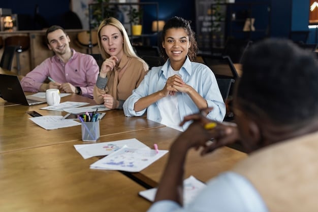 A diverse group of small business employees gathered around a conference table engaged in a discussion about payroll and benefits. The atmosphere is collaborative and professional.