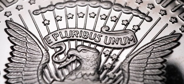 A detailed close-up of a stack of US dollar bills with a small FDIC logo watermark, emphasizing deposit safety and federal insurance.