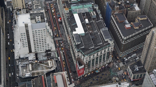 A detailed, aerial view of the New York Stock Exchange floor, bustling with traders, with a superimposed digital overlay showing global financial charts and a downward trend arrow pointing towards a weakened US dollar symbol, indicating international investor concern.