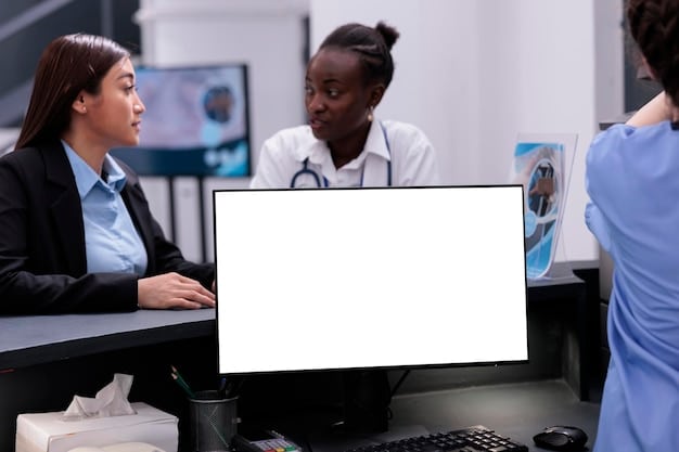 A diverse team of healthcare professionals and IT specialists collaborating around a large monitor displaying complex data dashboards and network diagrams, illustrating strategic decision-making for IT investments.