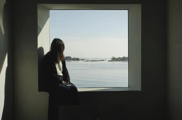 A person in a serene setting, perhaps looking out a window thoughtfully, with a subtle glow, symbolizing hope and inner peace found through self-reflection and support, relevant to managing mental health.