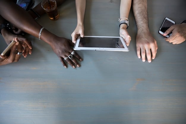 A close-up shot of a diverse group of people's hands, some holding smartphones, a tablet, and a laptop, all displaying video calls of therapists. This setup suggests multiple accessible options for remote mental health care.