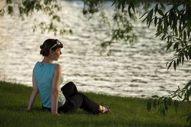 A person practicing deep breathing exercises in a tranquil park setting, emphasizing the calming effect of nature and breathwork.